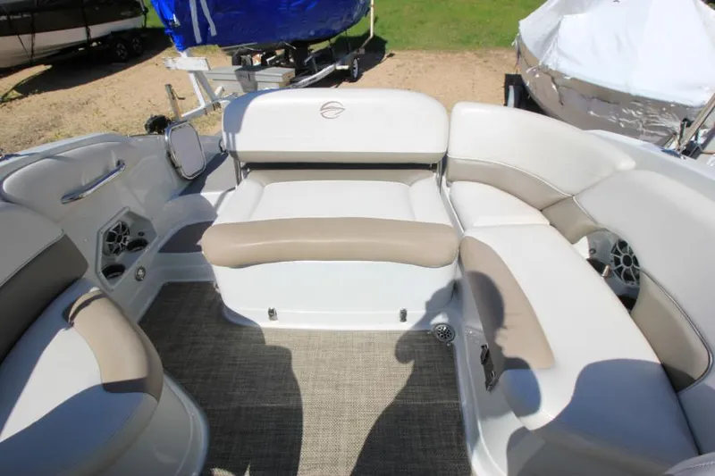 Slide: The Image of 2016 Crownline Eclipse E2 boat interior with beige and white seating arrangement. - 9