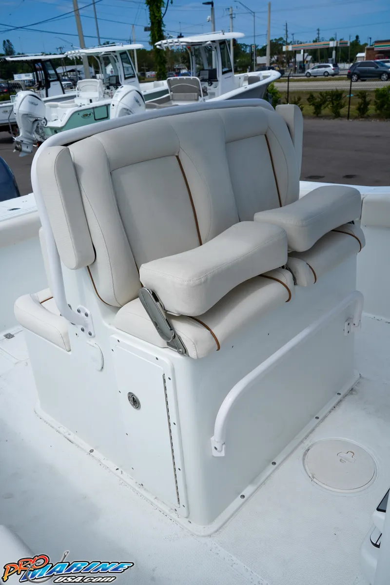 Slide: The Image of 2022 Sea Hunt GAMEFISH 27 CB boat seating, white cushioned helm seat. - 39