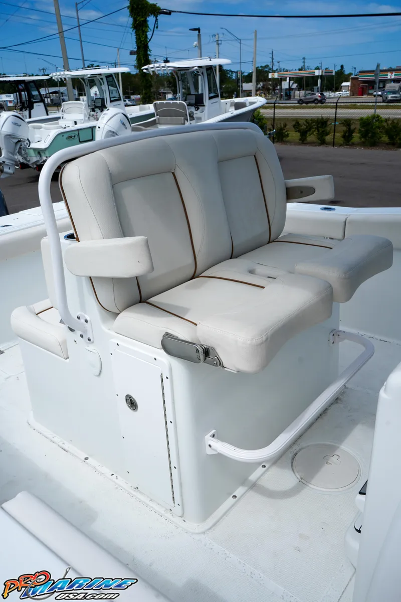 Slide: The Image of 2022 Sea Hunt GAMEFISH 27 CB boat with cushioned seating and armrests. - 40