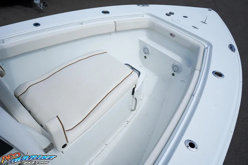 Slide: The Image of 2022 Sea Hunt GAMEFISH 27 CB boat interior with cushioned seating and speakers. - 41