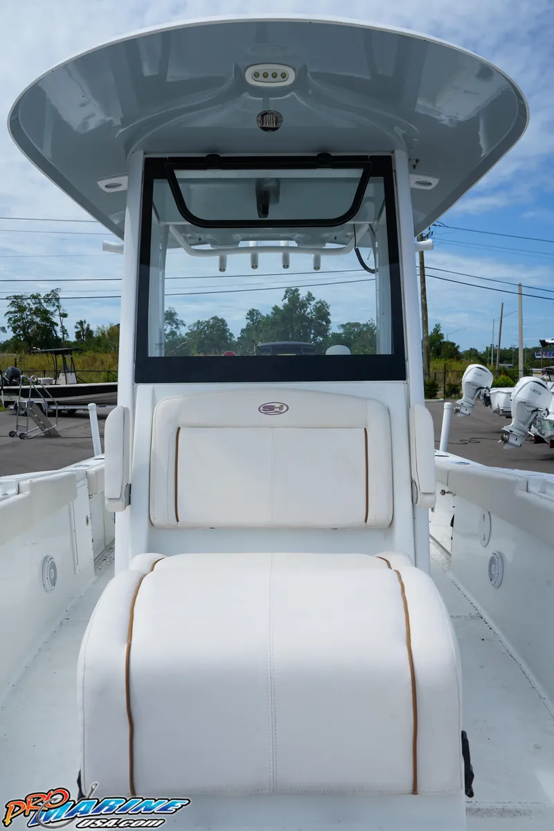 Slide: The Image of 2022 Sea Hunt GAMEFISH 27 CB boat interior with seating and console. - 45