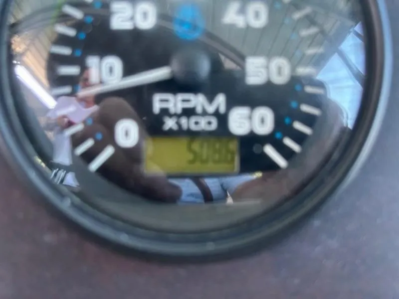 Slide: The Image of Close-up of a 2005 Carver Mariner 360 RPM gauge showing 5089 RPM. - 15