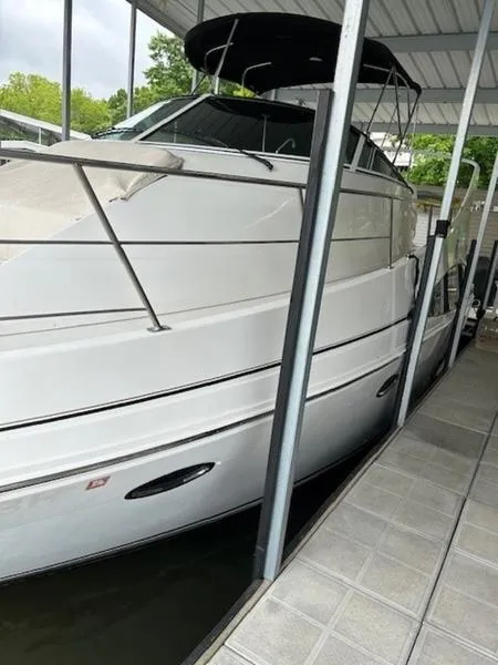 Slide: The Image of 2005 Carver Mariner 360 docked under a covered marina. - 16