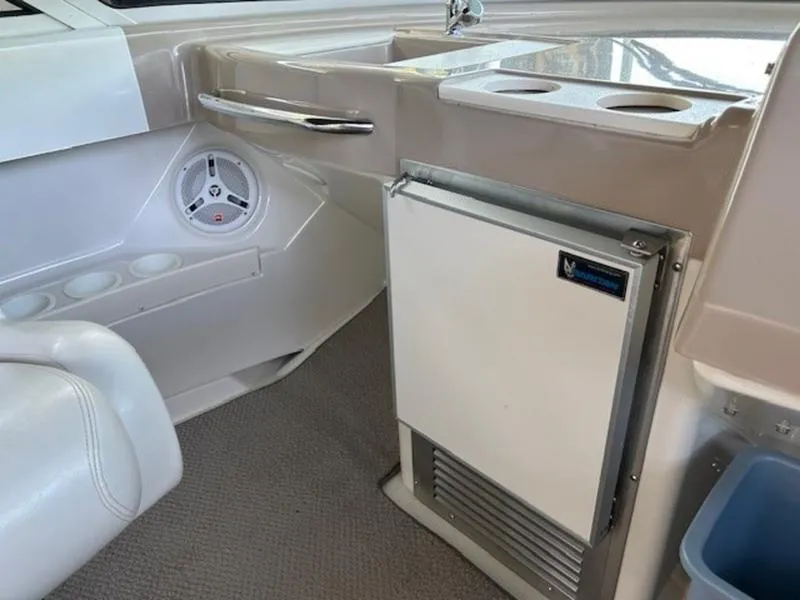 Slide: The Image of Interior of 2005 Carver Mariner 360 yacht with mini fridge and cup holders. - 21