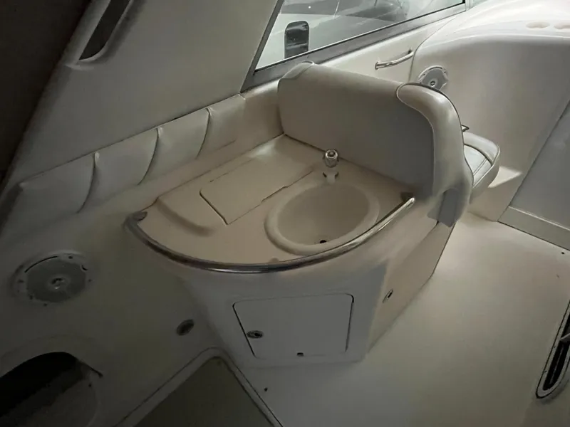 Slide: The Image of 1996 Sea Ray 330 Sundancer interior with sink and seating area. - 12