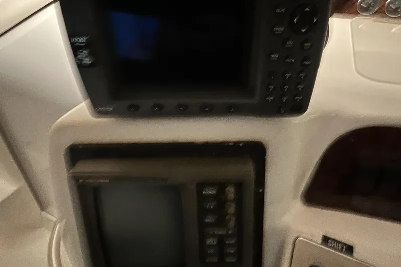 Slide: The Image of Control panel of a 1996 Sea Ray 330 Sundancer boat with navigation equipment. - 17