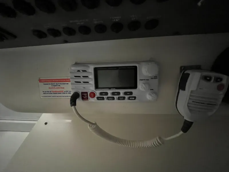 Slide: The Image of VHF radio system on 1996 Sea Ray 330 Sundancer boat dashboard. - 18
