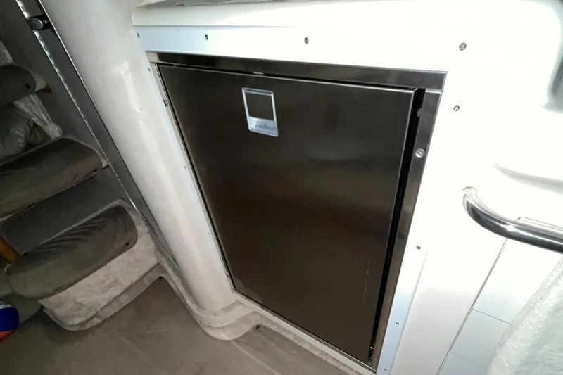 Slide: The Image of Stainless steel refrigerator in 1996 Sea Ray 330 Sundancer yacht interior. - 25