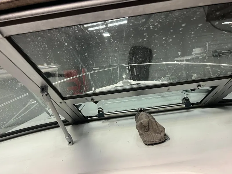 Slide: The Image of Interior view of 1996 Sea Ray 330 Sundancer boat through windshield. - 33