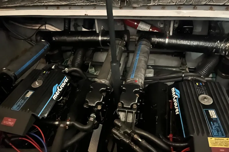 Slide: The Image of Engine compartment of a 1996 Sea Ray 330 Sundancer with twin MerCruiser engines. - 38