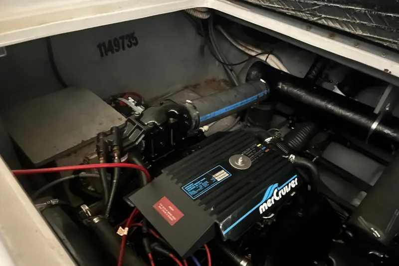 Slide: The Image of Engine compartment of 1996 Sea Ray 330 Sundancer with MerCruiser engine components. - 40