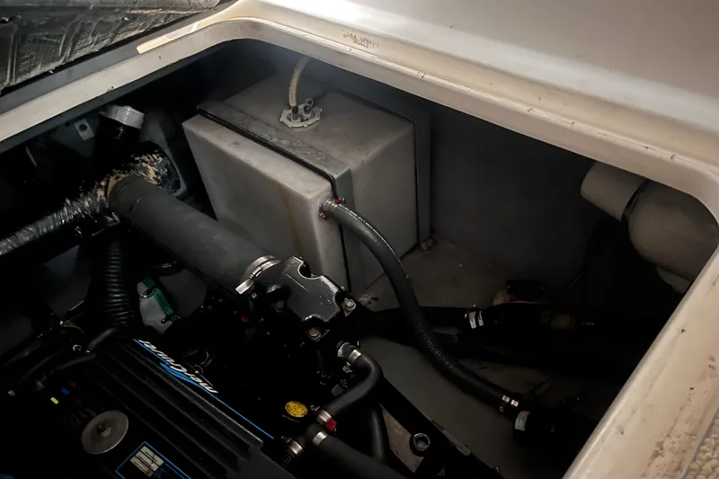 Slide: The Image of Engine compartment of a 1996 Sea Ray 330 Sundancer boat, showing mechanical components. - 42