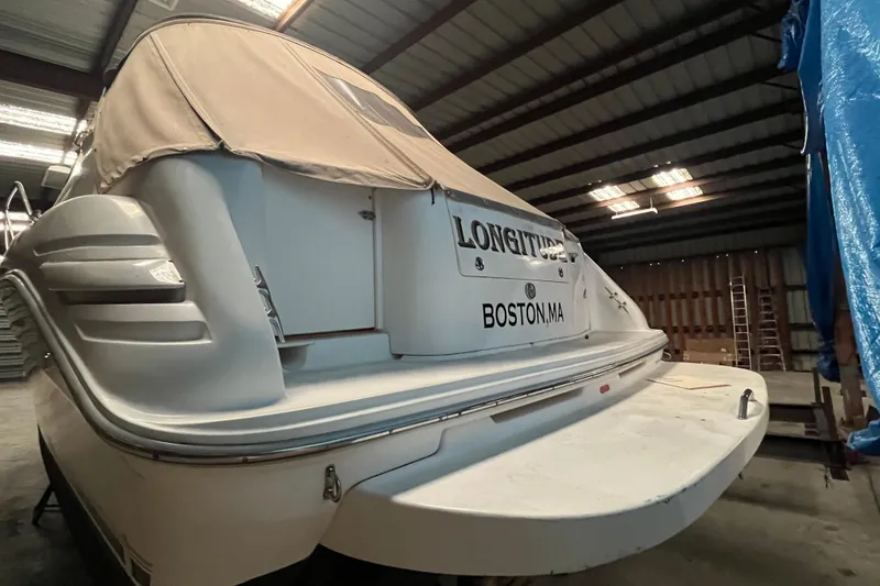 Slide: The Image of 1996 Sea Ray 330 Sundancer boat in storage, rear view, Boston, MA. - 7