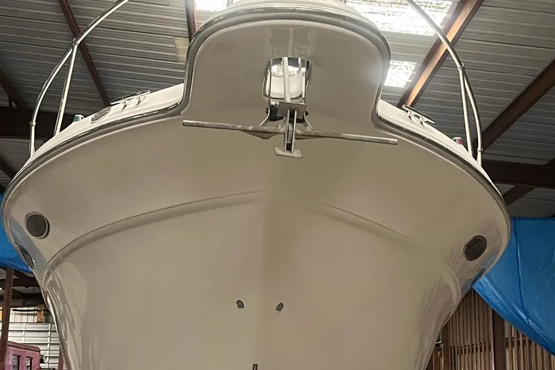 Slide: The Image of 1996 Sea Ray 330 Sundancer boat in storage, viewed from the front. - 9