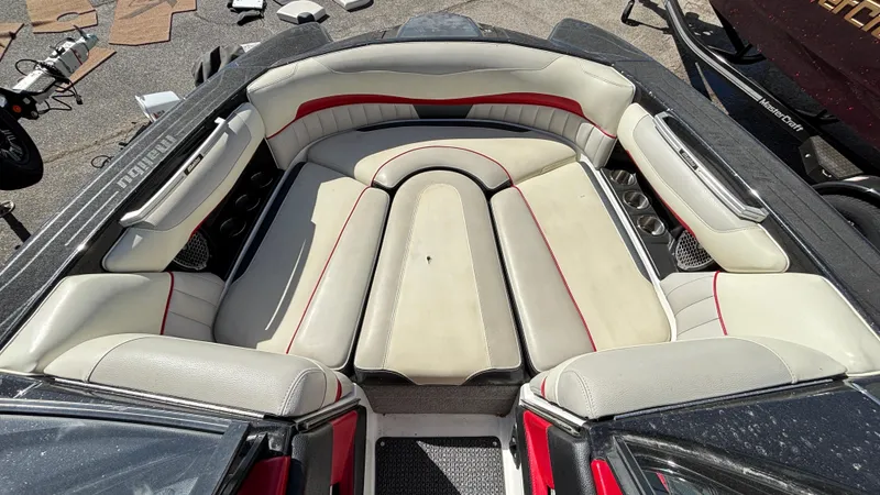 Slide: The Image of Interior of a 2015 Malibu Wakesetter 22 MXZ boat with cushioned seating. - 5
