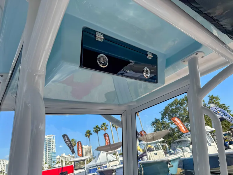 Slide: The Image of 2025 Caymas 24 HB boat interior with storage compartment, showcasing sleek design and modern features. - 17