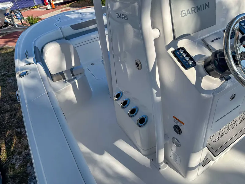 Slide: The Image of 2025 Caymas 24 HB boat interior with Garmin system and steering wheel. - 26