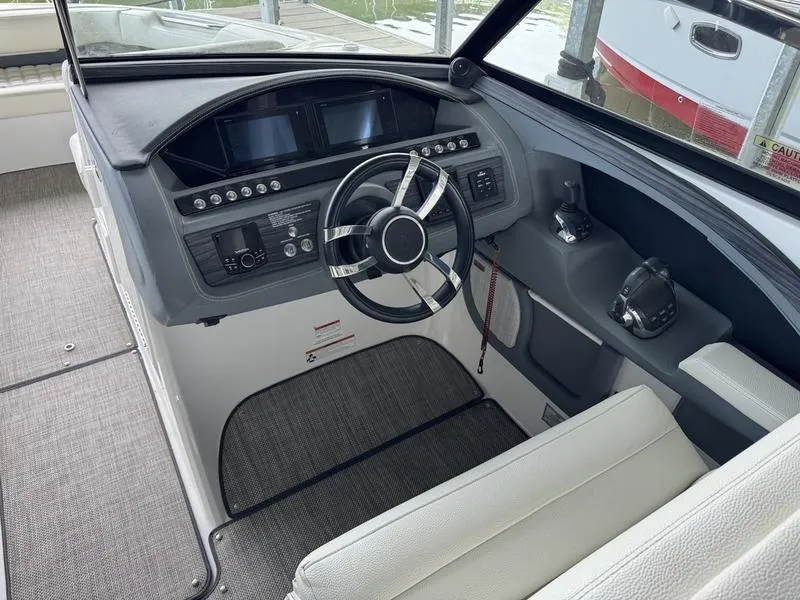 Slide: The Image of 2018 Cobalt R30 boat cockpit with modern steering and control panel. - 3