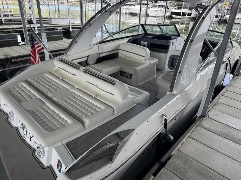 Slide: The Image of 2018 Cobalt R30 boat with spacious seating, docked in a marina. - 5