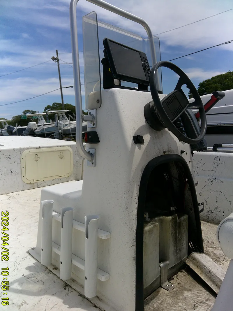 Slide: The Image of 2000 Carolina Skiff 1765 DLX boat console with steering wheel and electronics. - 15