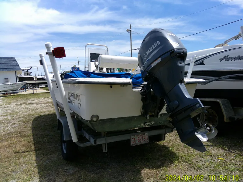 Slide: The Image of 2000 Carolina Skiff 1765 DLX boat with Yamaha outboard motor on trailer. - 2