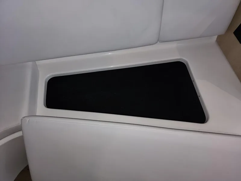 Slide: The Image of 2023 Regal 28 Express interior seating with sleek white upholstery. - 15