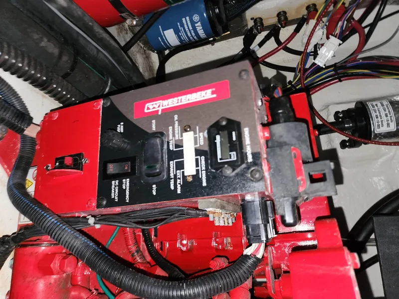 Slide: The Image of Electrical panel in a 2023 Regal 28 Express boat engine compartment. - 16