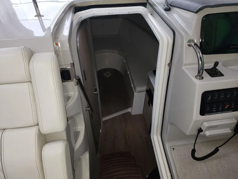 Slide: The Image of 2023 Regal 28 Express cabin entrance with modern interior and control panel. - 6