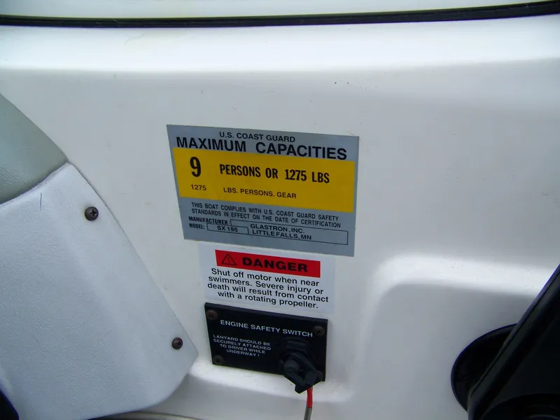 Slide: The Image of 2000 Glastron SX195 capacity label, 9 persons or 1275 lbs, safety warnings visible. - 6