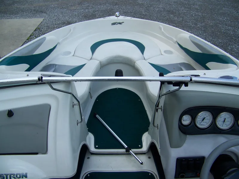Slide: The Image of 2000 Glastron SX195 boat interior with dashboard and seating area. - 7