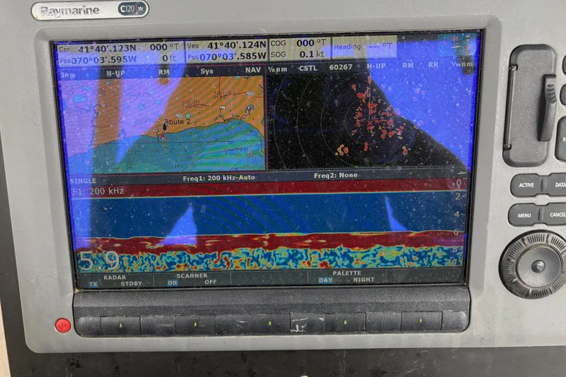 Slide: The Image of Fishfinder display on a 2008 Pursuit 2570 CC boat showing sonar and navigation data. - 8