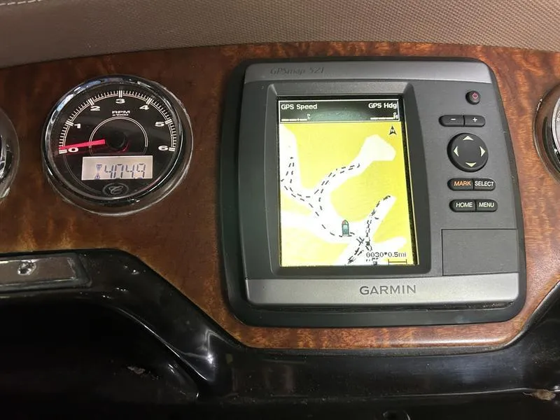 Slide: The Image of Dashboard of a 2010 Cobalt 302 with Garmin GPS and speedometer. - 21