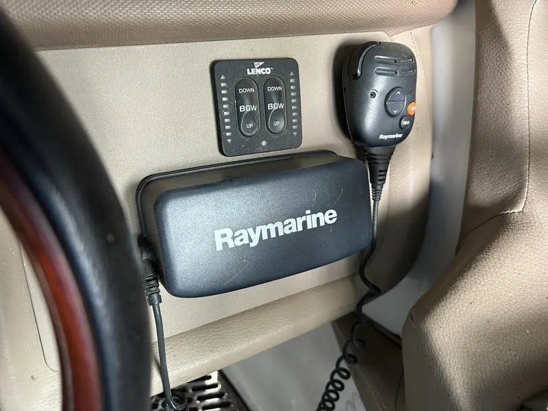 Slide: The Image of Raymarine and Lenco controls in 2010 Cobalt 302 boat interior. - 24