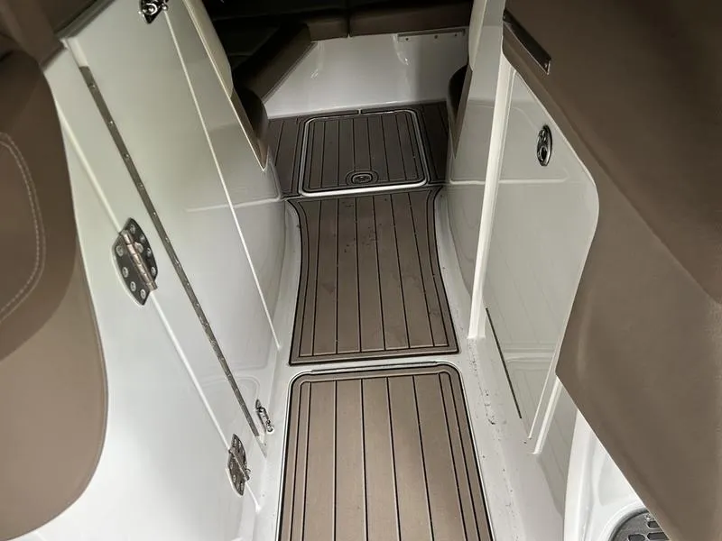 Slide: The Image of Interior of a 2010 Cobalt 302 boat with sleek wood flooring. - 27