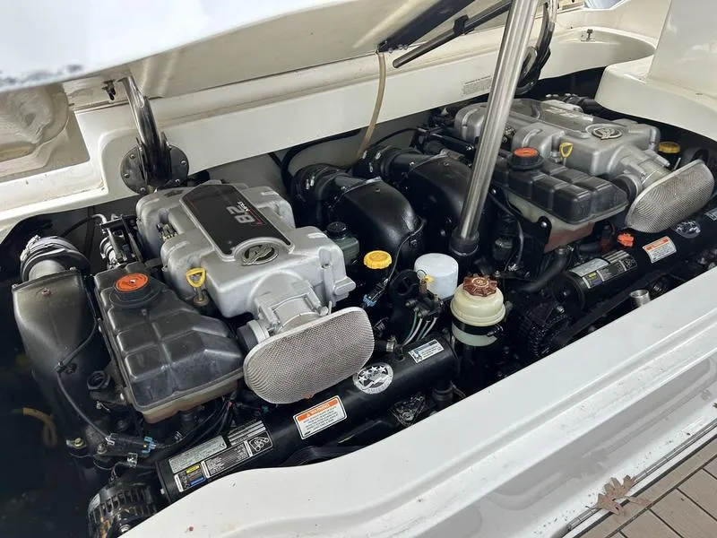 Slide: The Image of Engine compartment of a 2010 Cobalt 302 boat, showcasing dual engines and components. - 29
