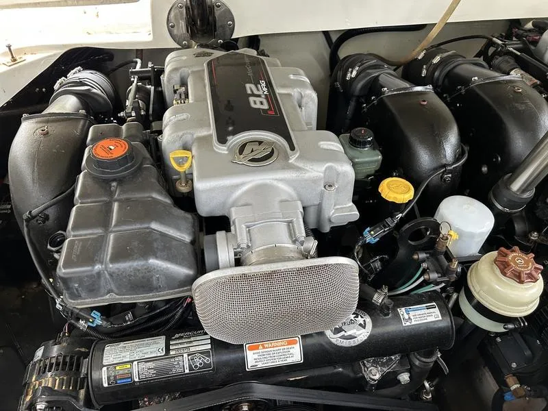 Slide: The Image of Engine of a 2010 Cobalt 302 boat, showcasing detailed components and layout. - 31