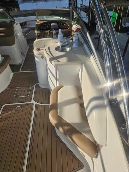 Slide: The Image of 2010 Cobalt 302 boat interior with seating and wooden flooring. - 4
