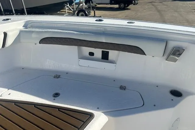 Slide: The Image of 2025 Tidewater 272 CC Adventure boat interior with seating and storage compartments. - 15
