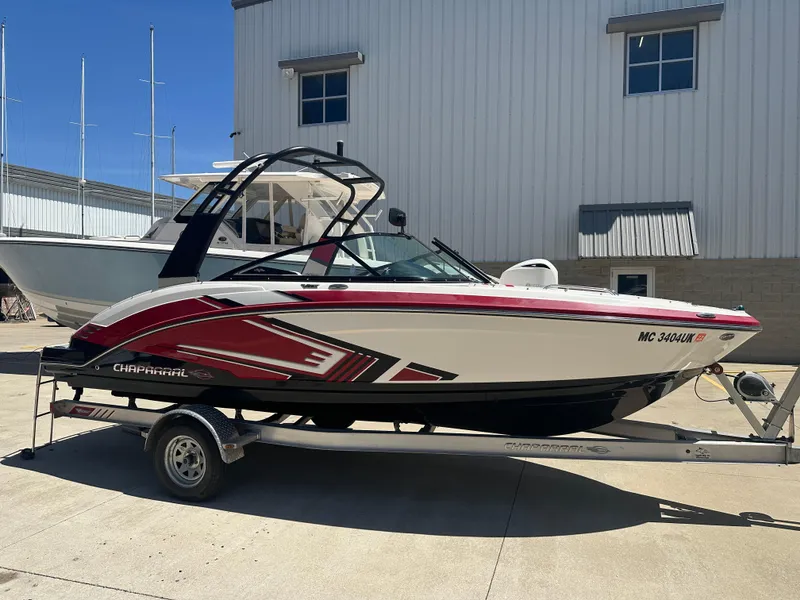 Slide: The Image of 2016 Chaparral Vortex 203 VRX boat on trailer, parked outdoors. - 0