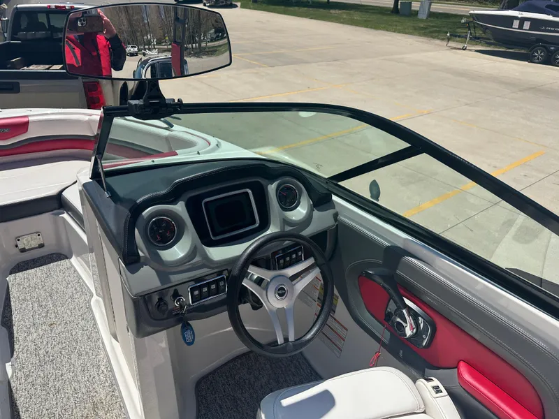 Slide: The Image of 2016 Chaparral Vortex 203 VRX boat interior with steering wheel and dashboard. - 6