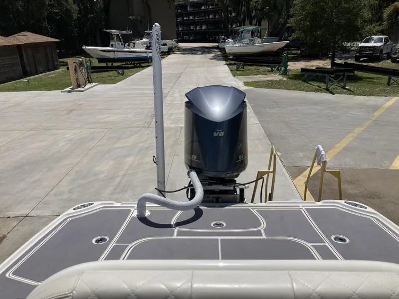 Slide: The Image of 2016 SeaVee 270Z boat with outboard motor at a marina dock. - 11