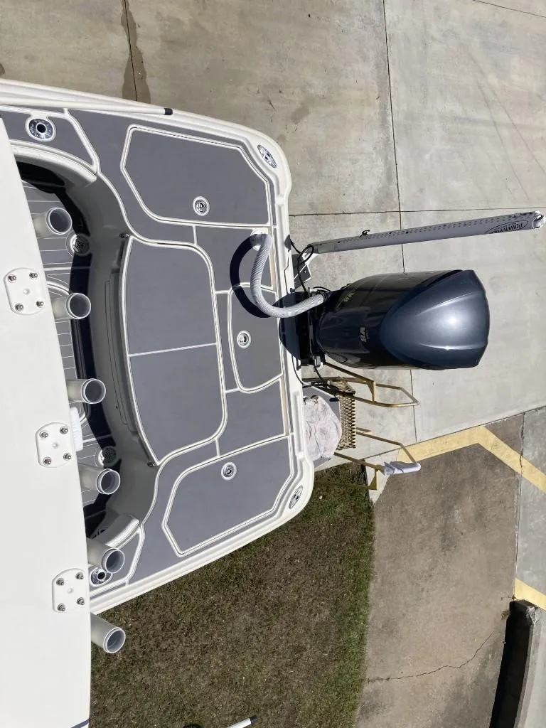 Slide: The Image of 2016 SeaVee 270Z boat with gray deck and outboard motor, viewed from above. - 14