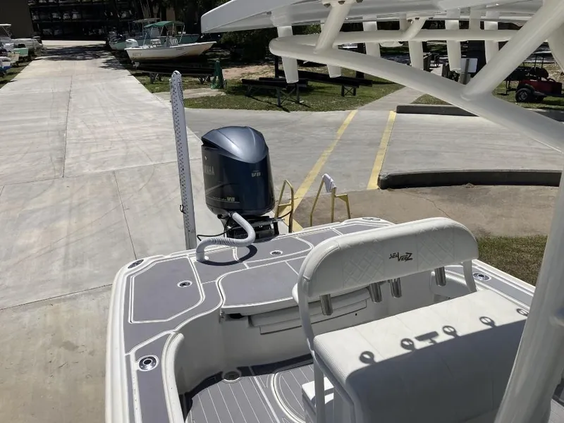 Slide: The Image of 2016 SeaVee 270Z boat with Yamaha outboard motor, docked on a sunny day. - 15