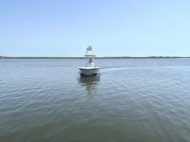 Slide: The Image of 2016 SeaVee 270Z boat cruising on calm waters under clear blue sky. - 20