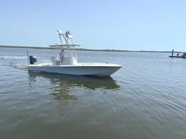 Slide: The Image of 2016 SeaVee 270Z boat cruising on calm waters under clear skies. - 21