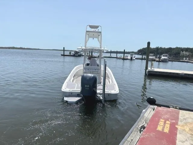Slide: The Image of 2016 SeaVee 270Z boat docked in a serene marina setting. - 22