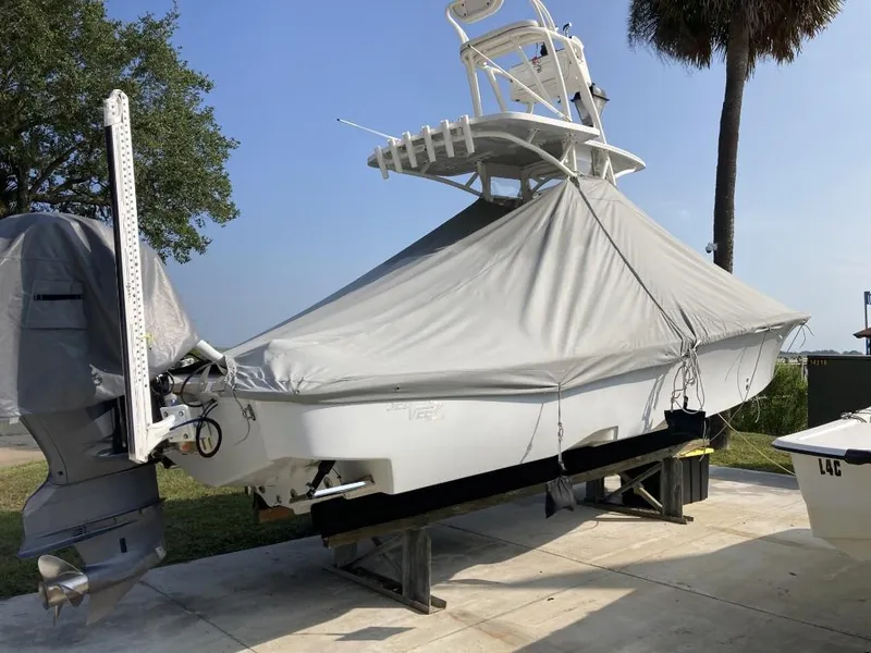 Slide: The Image of 2016 SeaVee 270Z boat covered and docked on a sunny day. - 5