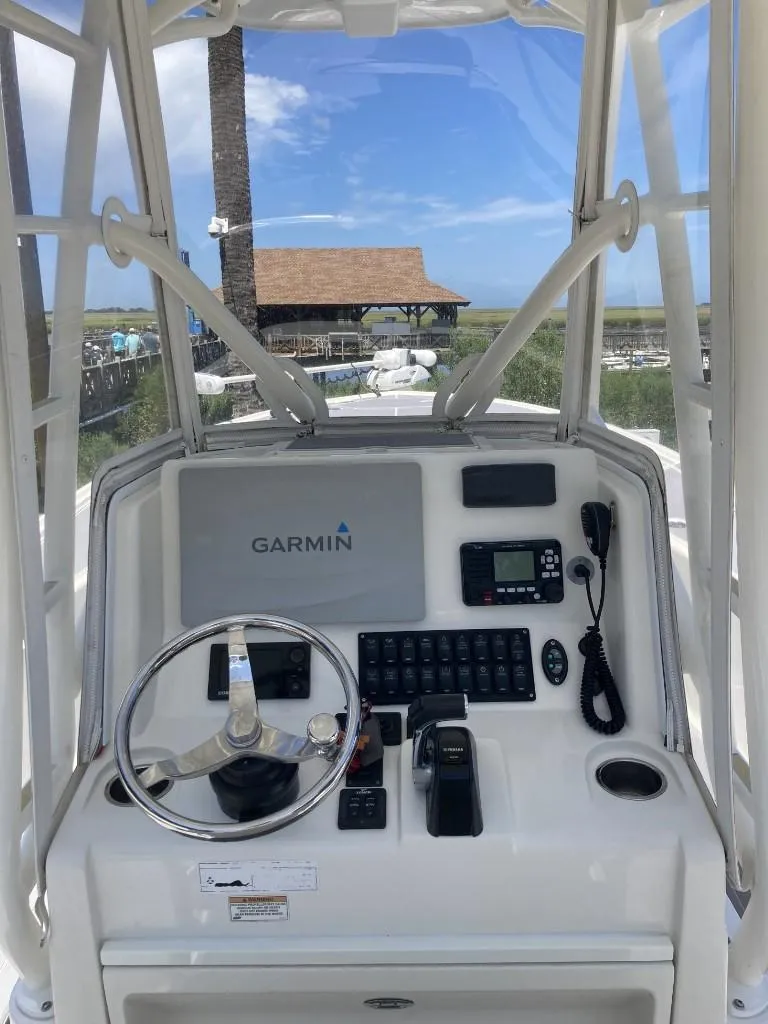 Slide: The Image of 2016 SeaVee 270Z boat console with Garmin navigation system and steering wheel. - 6