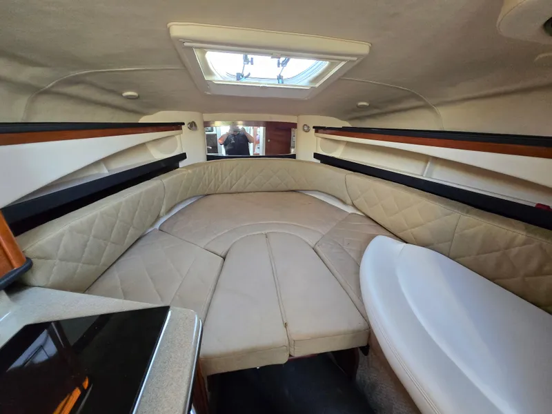 Slide: The Image of Interior of 2007 Sea Ray 260 Sundancer boat with cozy seating and skylight. - 18