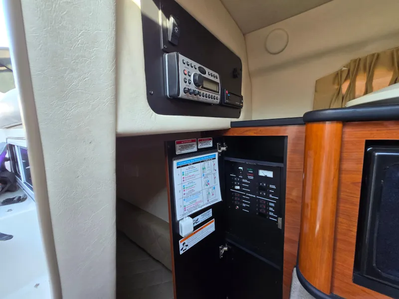 Slide: The Image of Interior view of 2007 Sea Ray 260 Sundancer showing control panel and stereo system. - 22